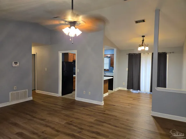 a view of a kitchen with a sink and a chandelier