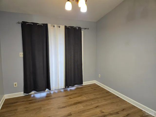 a view of a livingroom with wooden floor
