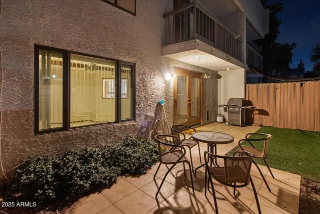 a view of a chairs and table in a patio