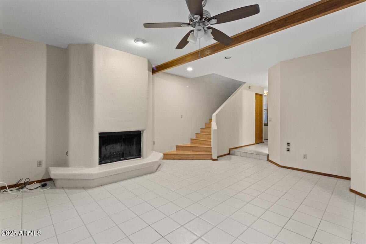 5750 North 10th Street, Unit 5 Phoenix, AZ 85014 - Photo 13 of 37 an empty room with windows and fireplace