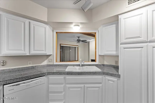 a kitchen with granite countertop cabinets and granite counter tops
