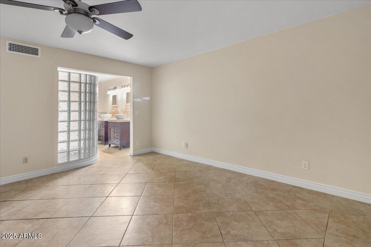 5750 North 10th Street, Unit 5 Phoenix, AZ 85014 - Photo 24 of 37 a view of an empty room with a window