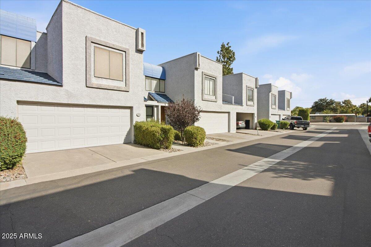 5750 North 10th Street, Unit 5 Phoenix, AZ 85014 - Photo 2 of 37 a front view of a building with a road