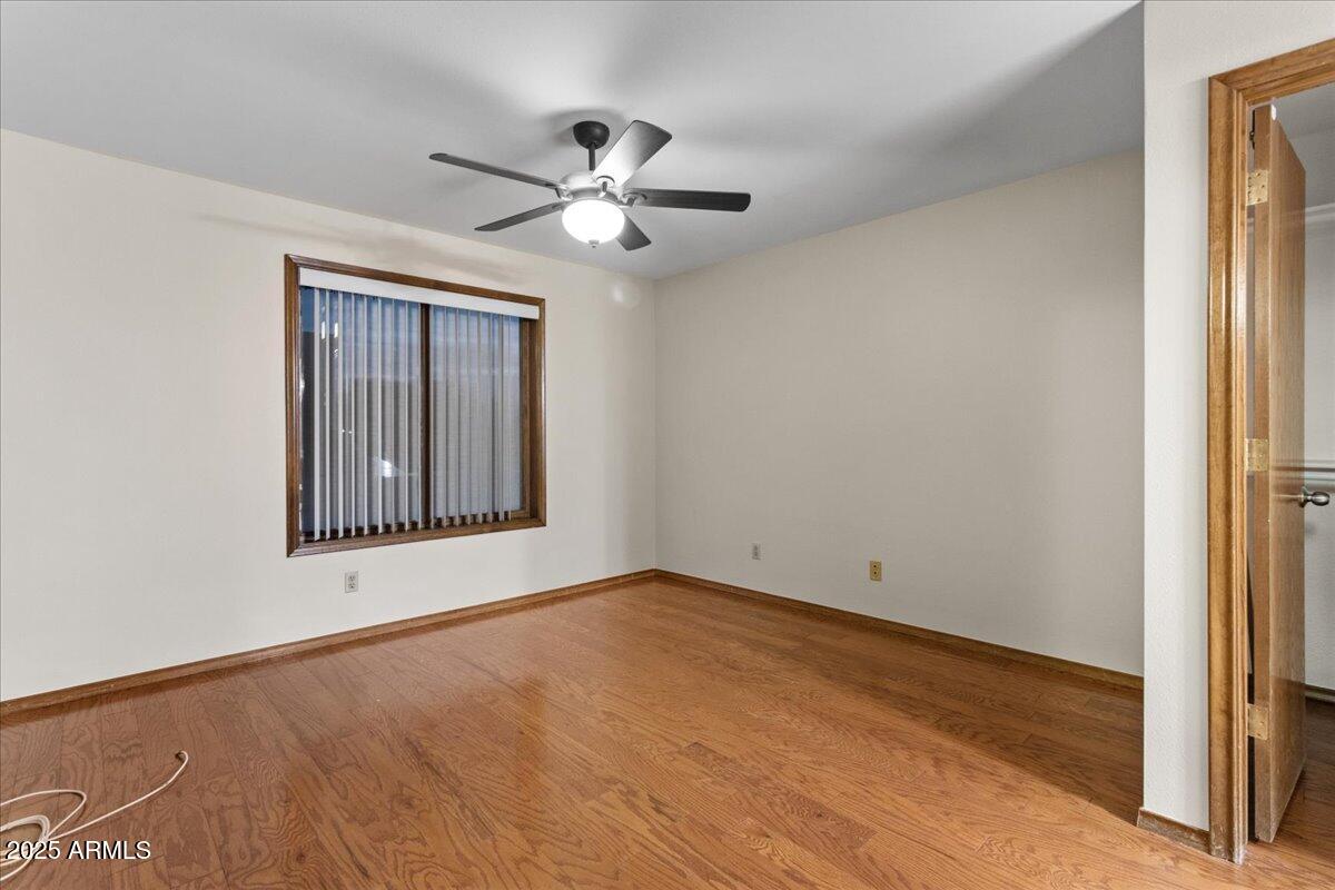 5750 North 10th Street, Unit 5 Phoenix, AZ 85014 - Photo 31 of 37 an empty room with windows and fan