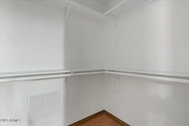 a view of an empty walk in closet