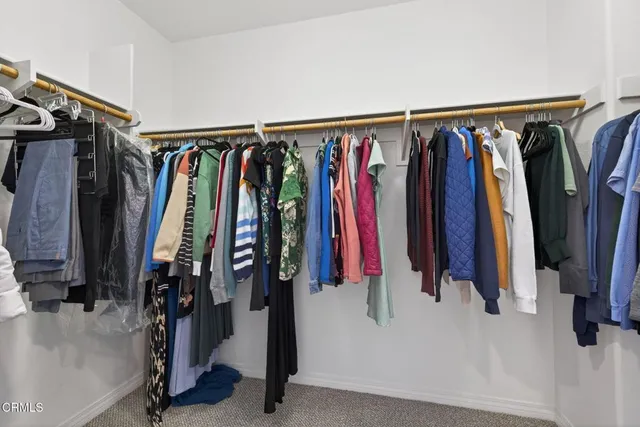 a view of a hallway with washer and dryer