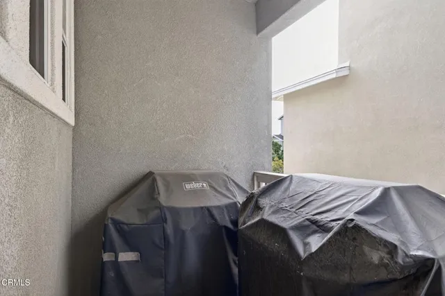 a car parked in front of a white house