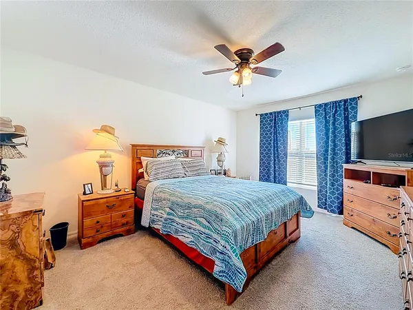a view of walk in closet with clothes