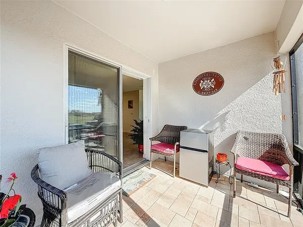 a view of a lake with a table and chairs