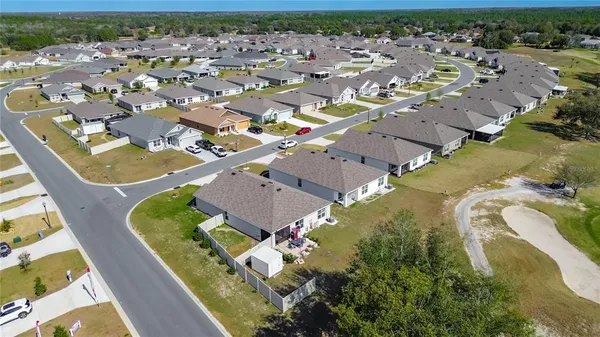 a hall way with furniture and a window