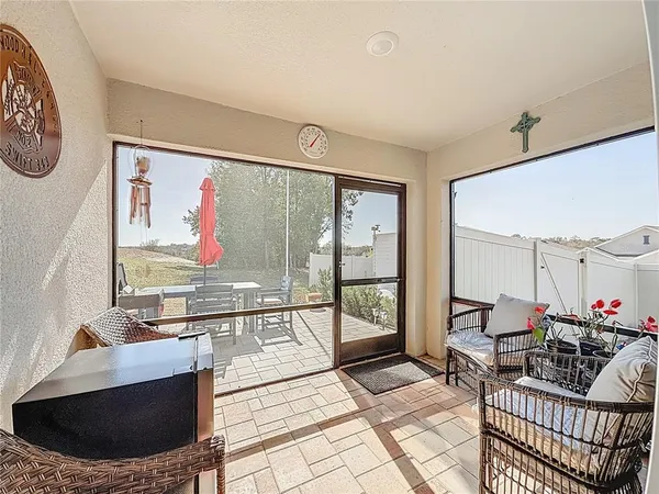 a view of swimming pool with outdoor seating and plants