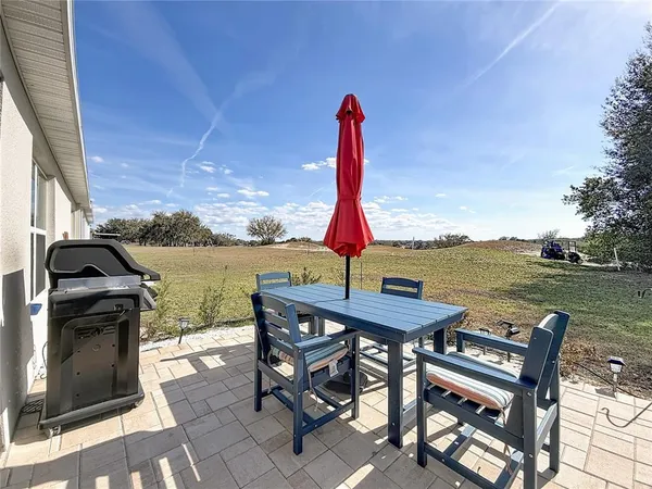 an aerial view of house with yard swimming pool and outdoor seating