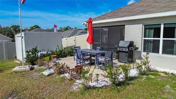 an aerial view of a house with outdoor space and a lake view