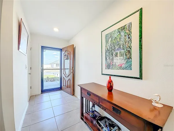 a view of a room with window and hardwood floor