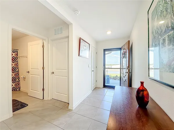 a view of a hallway with seating area