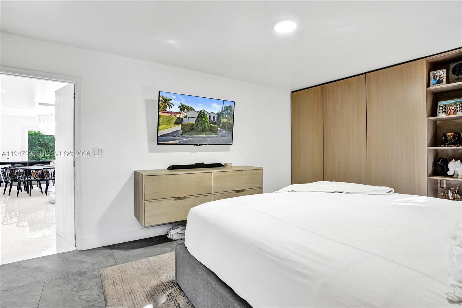 9181 Byron Avenue Surfside, FL 33154 - Photo 16 of 51 a bedroom with a bed and a painting on the wall