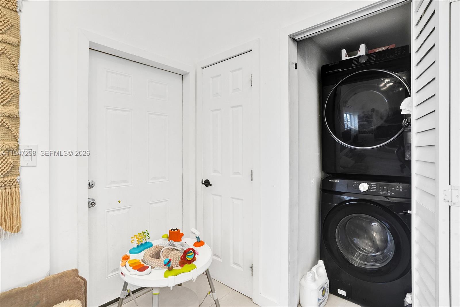 9181 Byron Avenue Surfside, FL 33154 - Photo 22 of 51 a utility room with dryer and washer