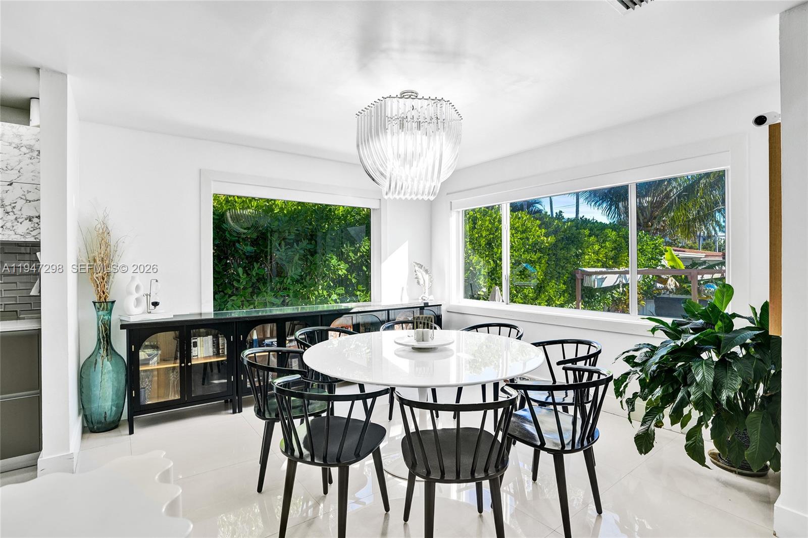 9181 Byron Avenue Surfside, FL 33154 - Photo 31 of 51 a view of a dining room with furniture window and outside view