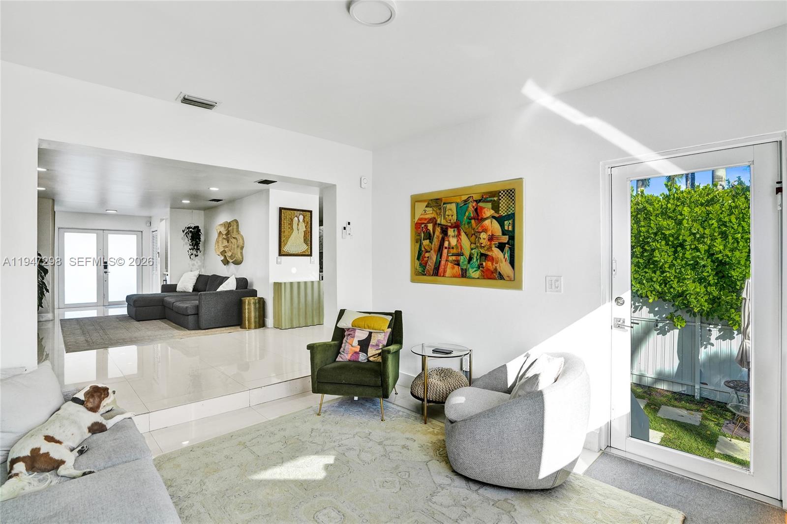 9181 Byron Avenue Surfside, FL 33154 - Photo 33 of 51 a living room with furniture and a large window