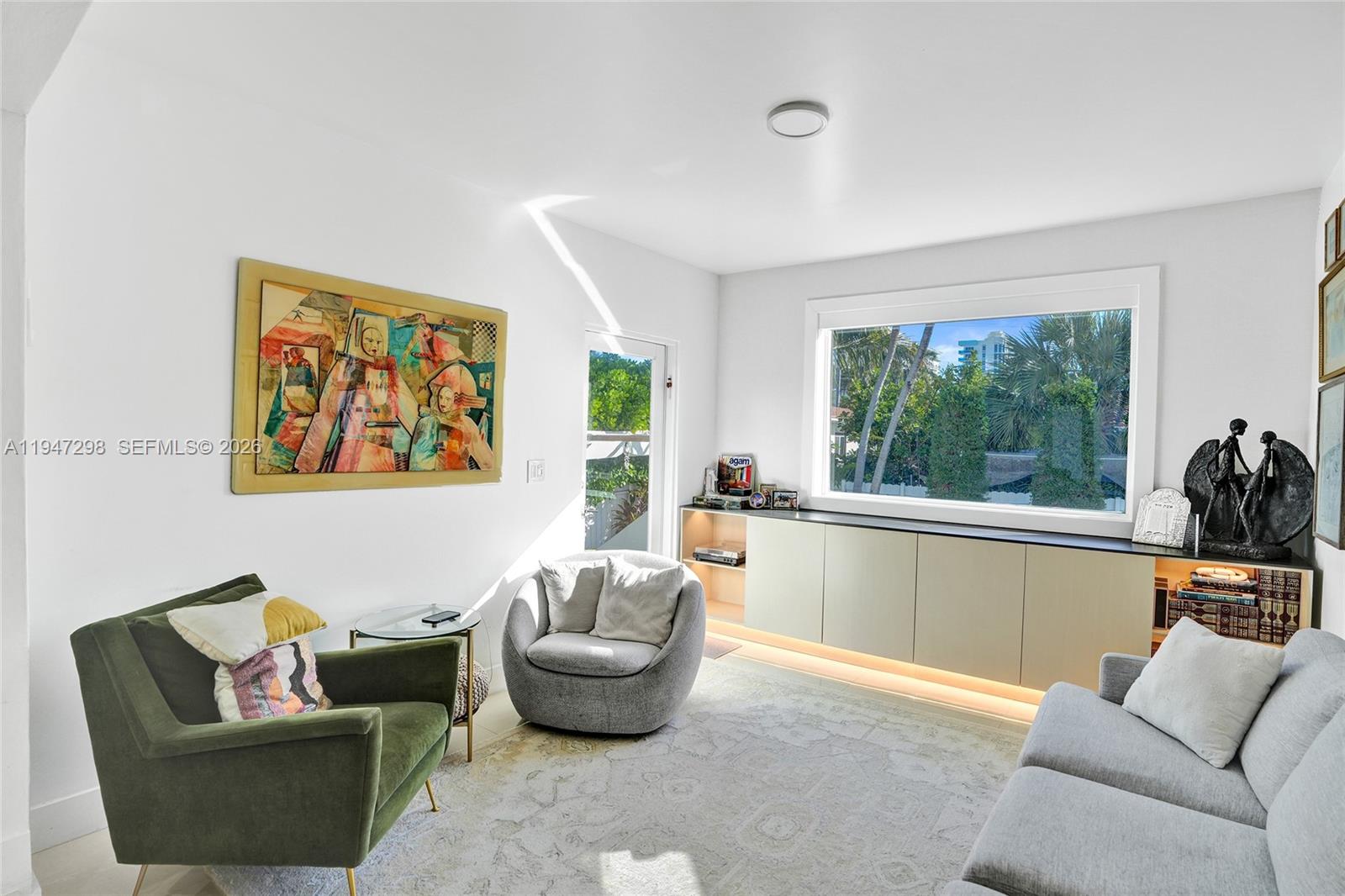 9181 Byron Avenue Surfside, FL 33154 - Photo 34 of 51 a living room with furniture and a large window