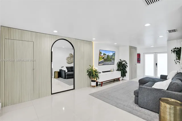 a living room with furniture and white walls