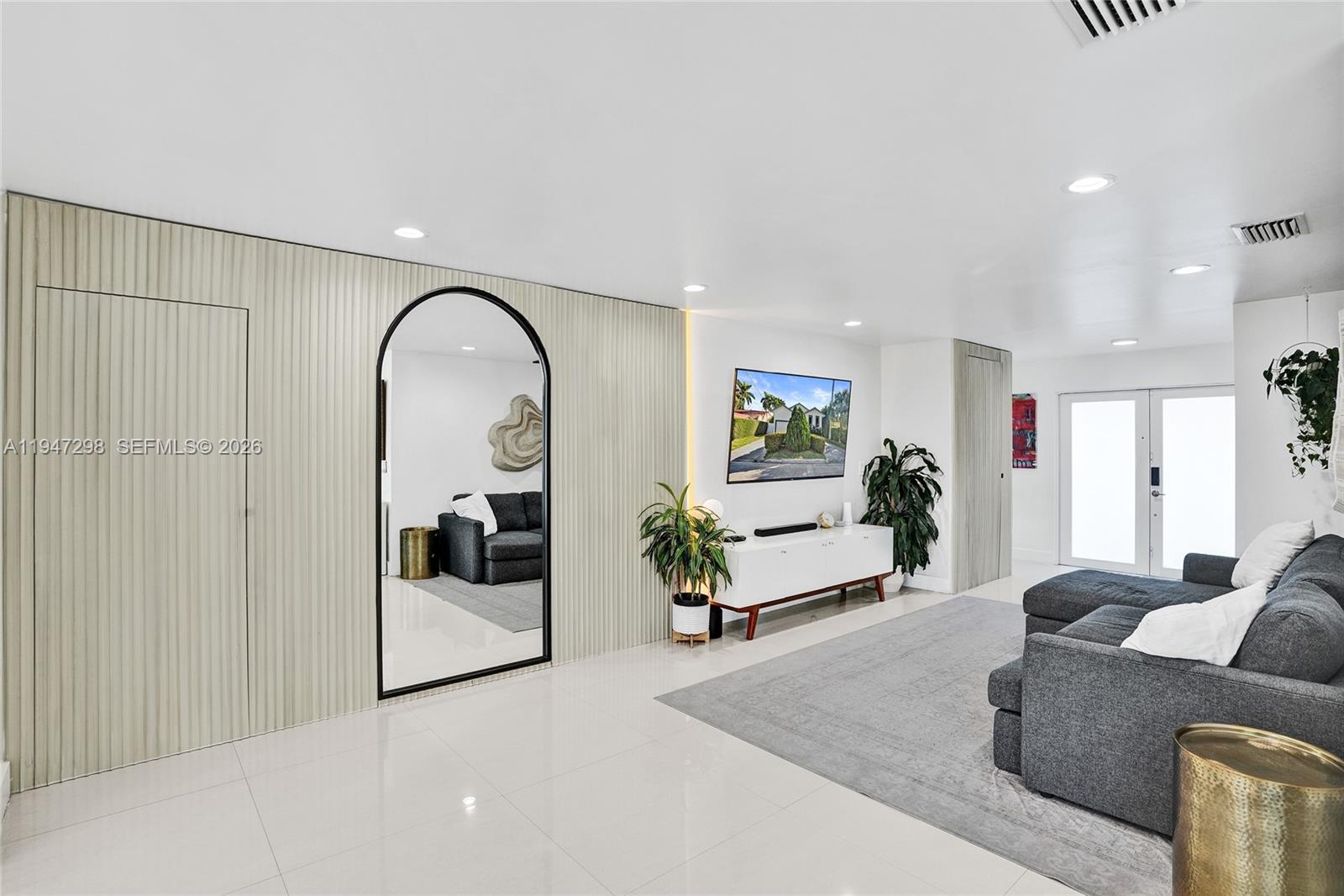 9181 Byron Avenue Surfside, FL 33154 - Photo 37 of 51 a living room with furniture and white walls