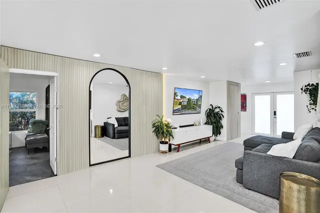 a living room with furniture and view of living room