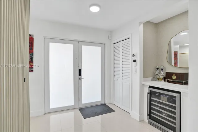 a view of a kitchen from the hallway