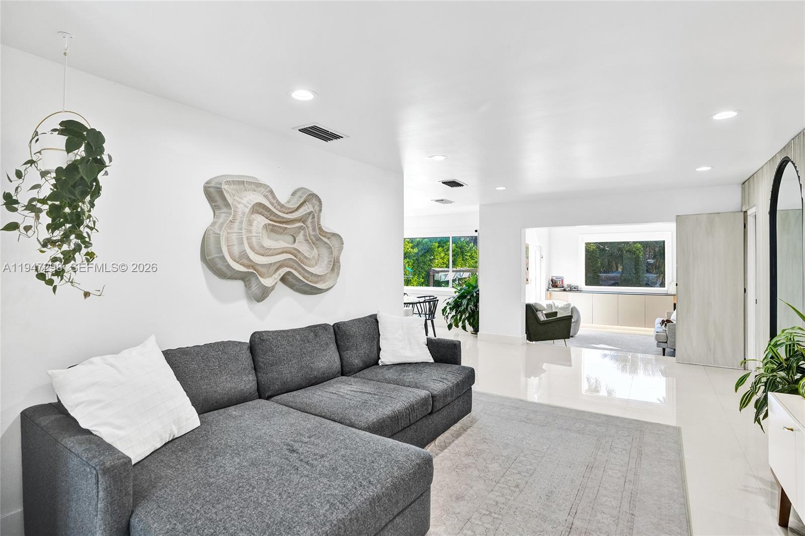 9181 Byron Avenue Surfside, FL 33154 - Photo 40 of 51 a living room with furniture and a large window
