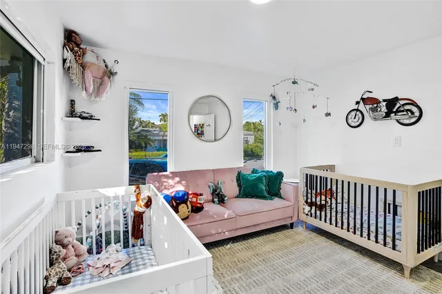 a bedroom with furniture and a window