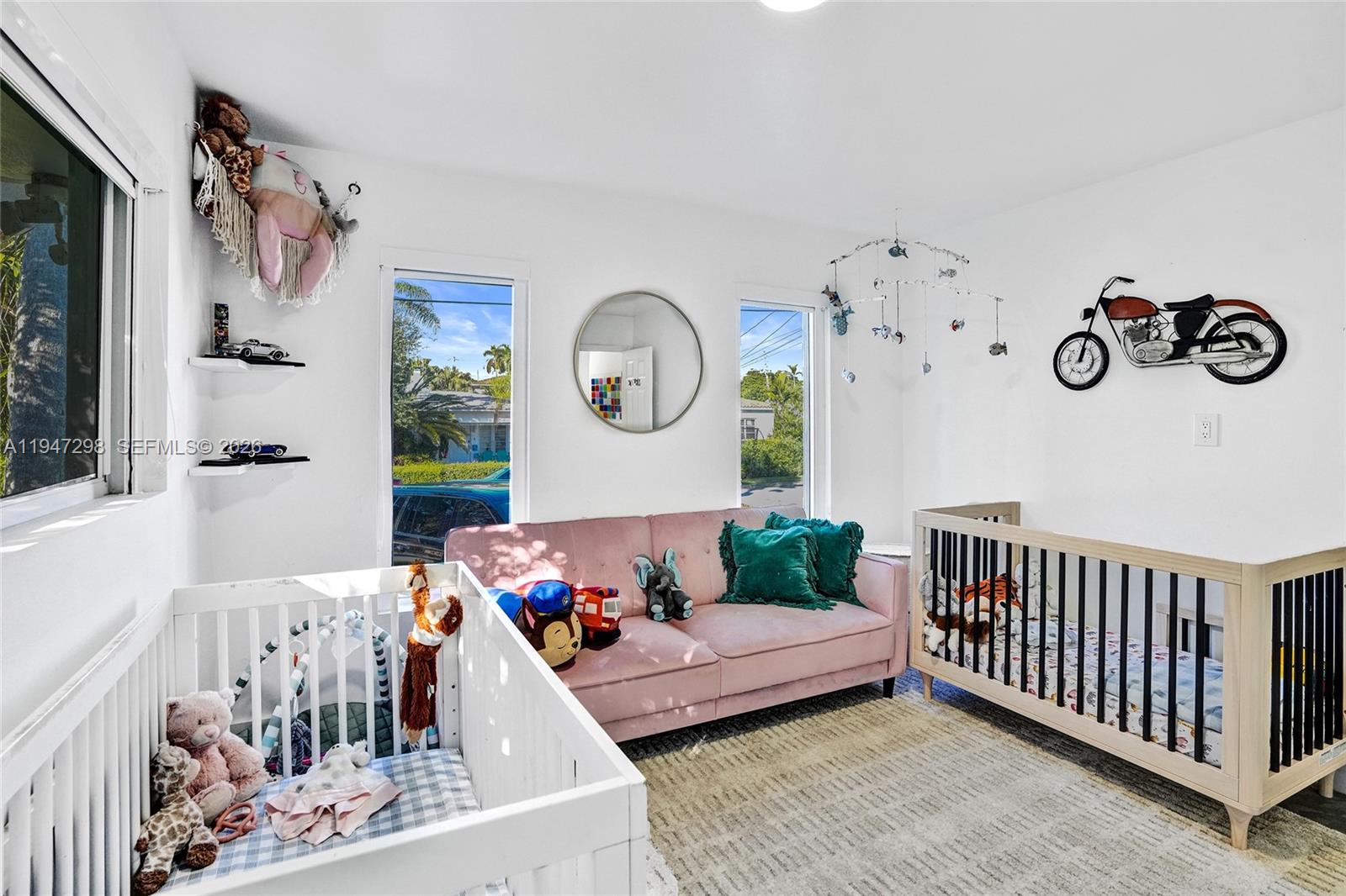 9181 Byron Avenue Surfside, FL 33154 - Photo 50 of 51 a living room with furniture and a window