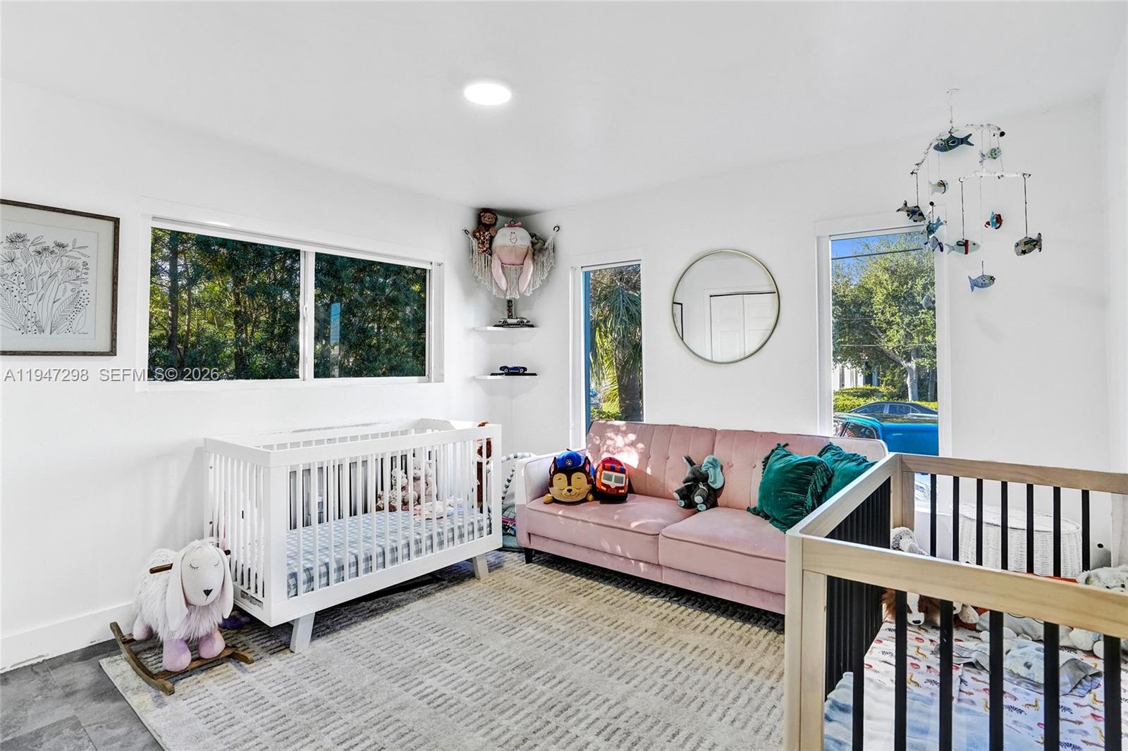 9181 Byron Avenue Surfside, FL 33154 - Photo 51 of 51 a bedroom with furniture and a window