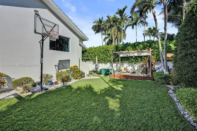 a view of a chair and table in the garden