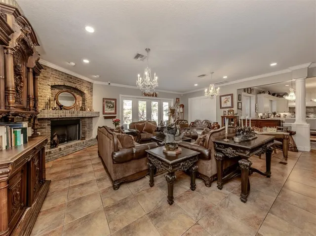 a spacious bathroom with a granite countertop double vanity sink and a mirror