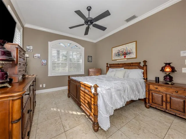 a living room with furniture a flat screen tv and kitchen view