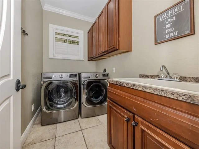 a view of a patio with chair and tables back yard of the house