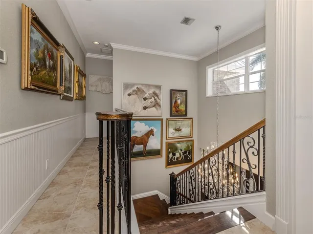 a living room with patio furniture and a potted plants