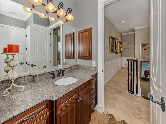 a view of a house with a yard and potted plants