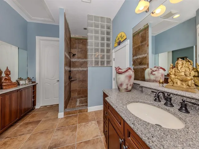 a bed room with a bed and a chandelier