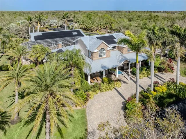 a kitchen with kitchen island granite countertop a sink stainless steel appliances and counter space