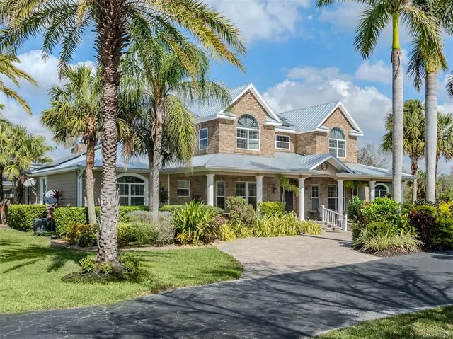 a kitchen with stainless steel appliances granite countertop a stove and a refrigerator