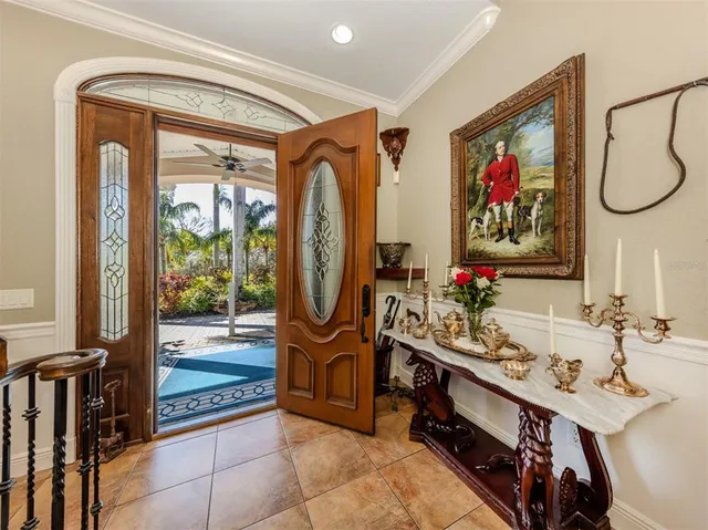 a dining room with furniture a rug and a chandelier