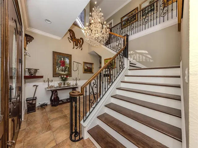 a living room with furniture a rug and a large window