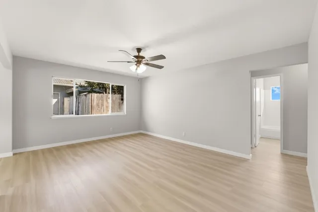 a view of an empty room with windows