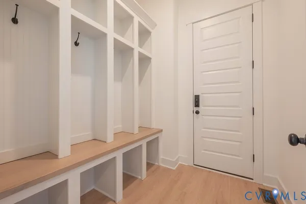 a view of an entryway with wooden floor