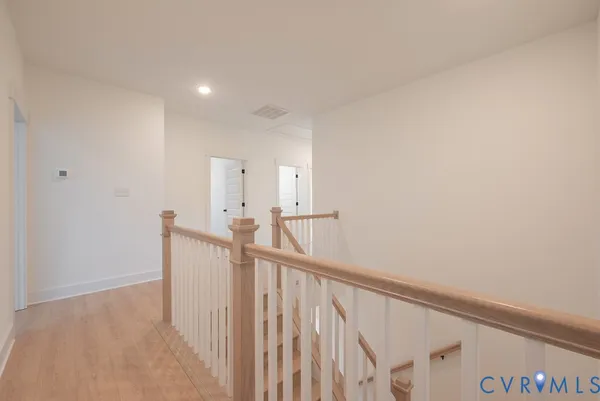 a view of a hallway with staircase