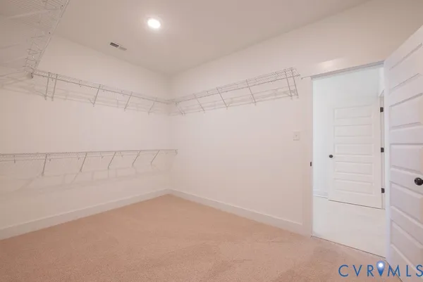 a view of a room with racks on the wall