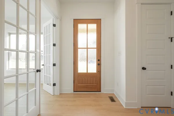 a view of entryway with wooden floor