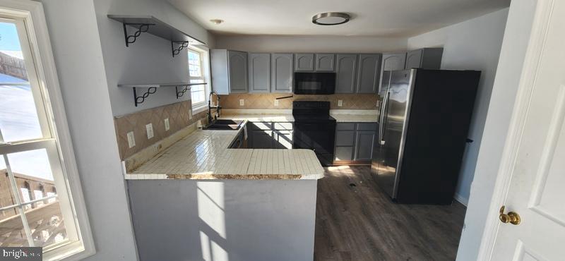 351 Thumper Drive Ranson, WV 25438 - Photo 12 of 45 Modern kitchen with sleek finishes.