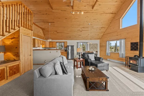 a living room with furniture and a table